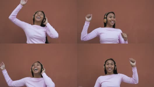 快乐的年轻拉丁女人用无线耳机跳舞听音乐高清在线视频素材下载
