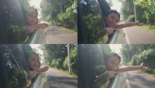 快乐的亚洲小女孩享受和父母在汽车上的公路旅行假期。高清在线视频素材下载