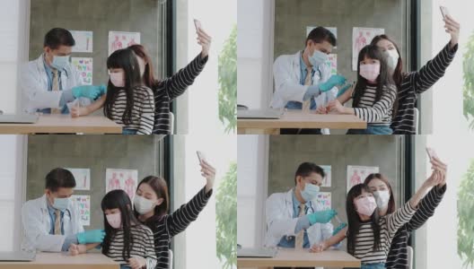 一名亚洲妇女在医生接种疫苗时自拍。高清在线视频素材下载