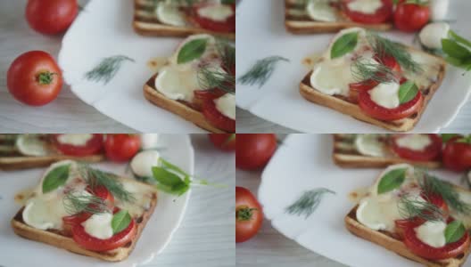 热烤面包配马苏里拉奶酪和西红柿高清在线视频素材下载