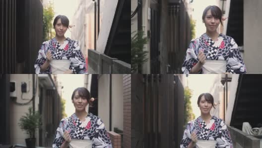 一位日本妇女走在一条狭窄的小径上高清在线视频素材下载