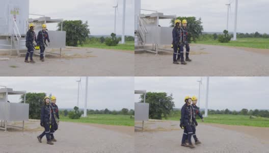 两名亚洲工程师统一检查工程师准备和进度检查风力涡轮机与安全在泰国风电场。高清在线视频素材下载