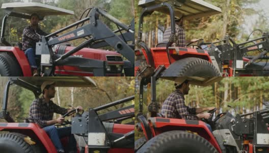 在一个现代化的农场里，一个年轻人驾驶着一辆小型农场拖拉机看着摄像机高清在线视频素材下载
