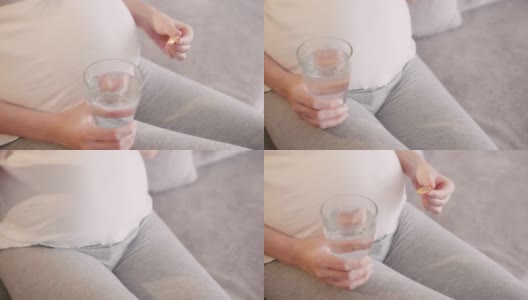 孕妇在家服用-3脂肪酸补充剂。高清在线视频素材下载