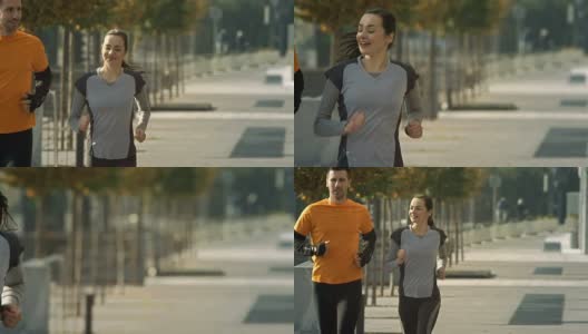 高清慢动作:情侣慢跑在人行道上高清在线视频素材下载