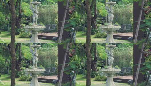 在夏天的背景花园喷溅喷泉高清在线视频素材下载