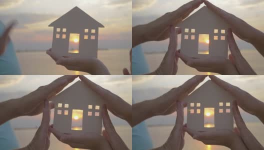 手握房子的剪影对太阳高清在线视频素材下载