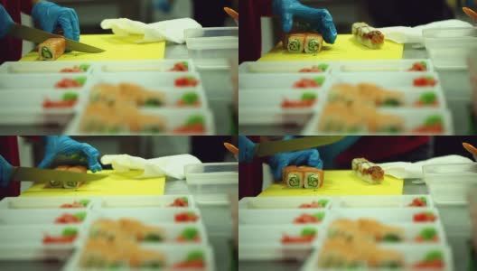 厨师将寿司和鱼切成薄片，特写高清在线视频素材下载