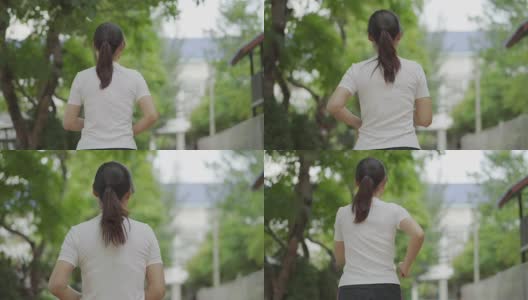 一个年轻女子在公园里跑步的慢镜头高清在线视频素材下载