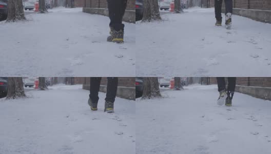 在韩国首尔冬天的雪地里，脚走路的慢动作高清在线视频素材下载