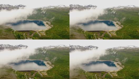 挪威。挪威美丽的风景。云雾笼罩着湖面，背景是群山和森林高清在线视频素材下载