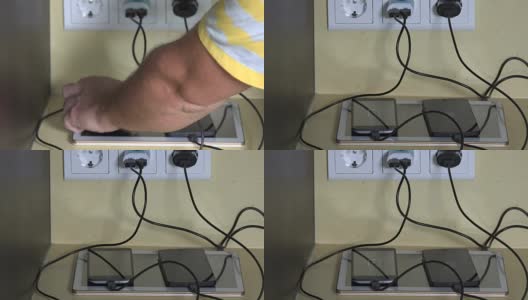 男性用微型usb线连接智能手机和平板电脑充电高清在线视频素材下载