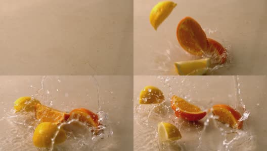 橙色和柠檬片落在潮湿的白色表面高清在线视频素材下载