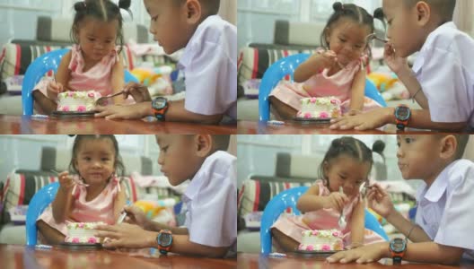 小女孩和家人一起吃生日蛋糕高清在线视频素材下载