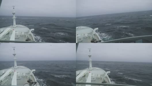 渔船在波涛汹涌的海面上捕鱼高清在线视频素材下载