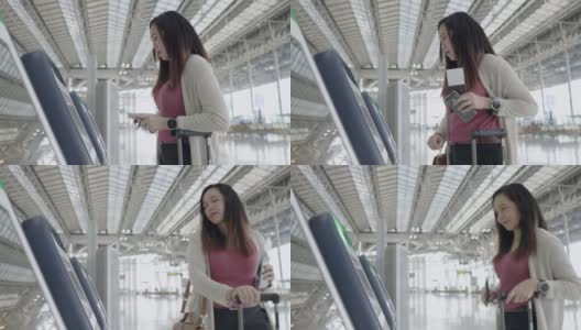 一名亚洲女性旅客在机场，用自动值机办理登机手续，办理她的旅行行李、旅行度假、侧视高清在线视频素材下载