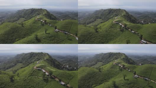 以拉乌山为背景的印度尼西亚科木宁茶园鸟瞰图高清在线视频素材下载