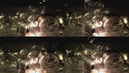 超级慢的运动玻璃碎片落在灯泡上。高清在线视频素材下载