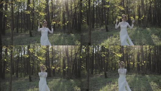 优雅的少女，穿着白色蕾丝长裙，走在春天的森林里，抚摸着藏在树枝后面的树叶。新娘穿着节日的衣服礼服站在绿色新鲜的树林微笑情绪幸福的生活高清在线视频素材下载