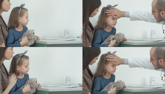 男儿科医生检查小女孩的头部发烧高清在线视频素材下载