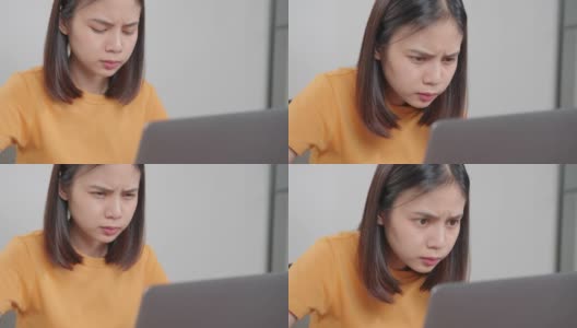 疲惫的年轻亚洲女性使用笔记本电脑，在长时间使用电脑工作后，在家庭办公室感觉眼睛疲劳。高清在线视频素材下载