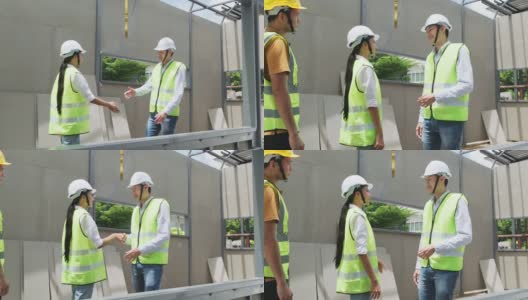 亚洲结构工程师和工人在建筑工地握手。所有人在建筑工地行走时须戴上安全帽。商业交易、并购概念高清在线视频素材下载