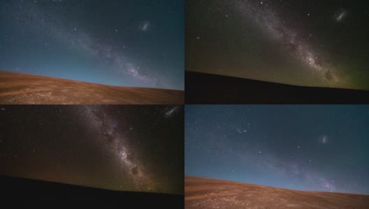 当月亮落下时，银河系在阿塔卡马沙漠的夜空中升起。一个敬畏的景象，星星和所有的人造卫星空间交通作为移动的星星在沙漠领域高清在线视频素材下载