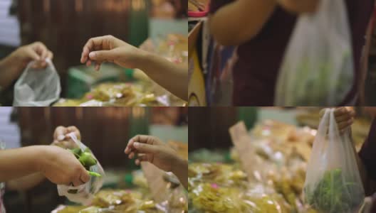 一个女人在街头食品市场买食物高清在线视频素材下载