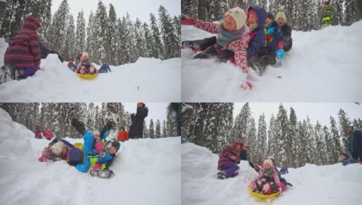 SLO MO TS孩子们从雪山上滑下来，从雪撬上摔下来高清在线视频素材下载