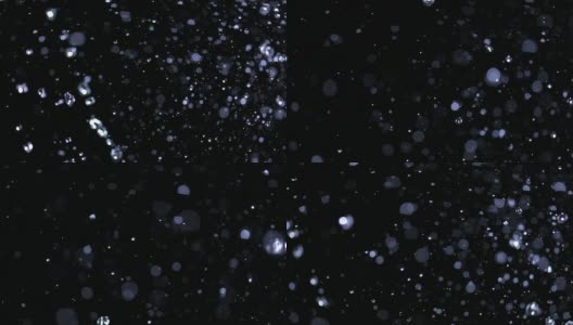 水滴闪烁在黑色背景上的SLO MO场高清在线视频素材下载