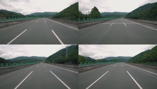 在现代高速公路上快速移动，山间三车道交通公路高清在线视频素材下载