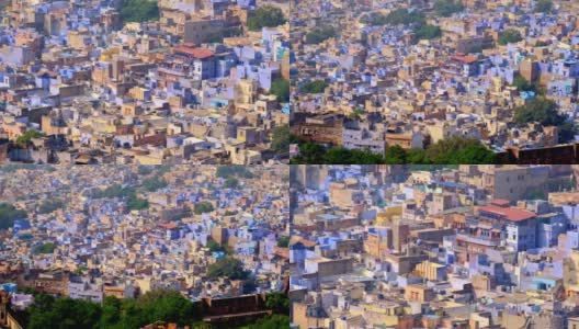焦特布尔的蓝色城市鸟瞰图。从印度拉贾斯坦邦梅兰加尔堡(Mehrangarh Fort)俯瞰，清晨婆罗门住宅上空，蓝色的房屋和鸟儿在飞翔。相机缩小高清在线视频素材下载