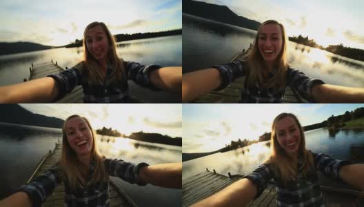女孩在湖边码头自拍高清在线视频素材下载