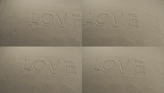 “爱”字写在沙滩上。滑块。爱——沙滩上的铭文高清在线视频素材下载