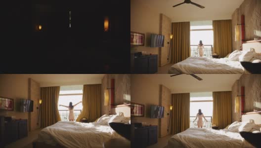 早晨在酒店，女士剪影打开窗帘高清在线视频素材下载