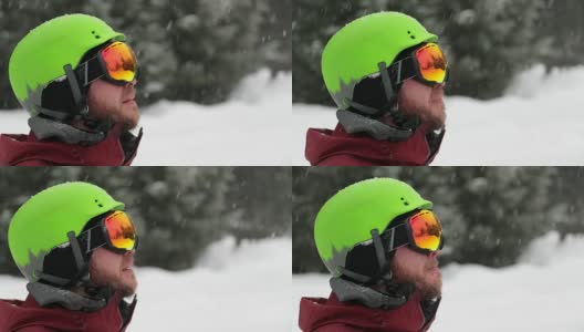 快乐的滑雪者在暴风雪期间户外滑雪板高清在线视频素材下载