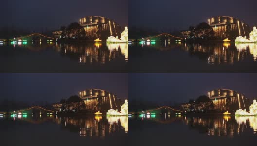 灯火通明的建筑和中国节日灯笼在夜晚的河上高清在线视频素材下载