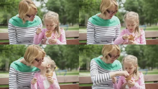 母亲和女儿在吃冰淇淋高清在线视频素材下载