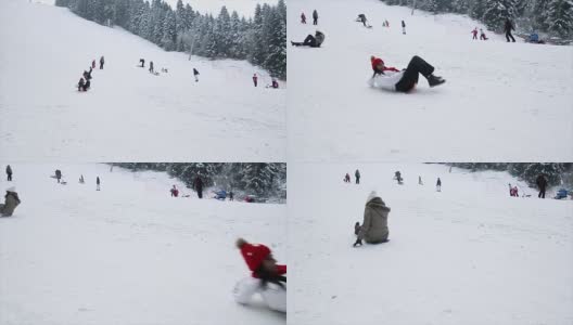 两个成年女子在滑雪坡上玩雪橇高清在线视频素材下载