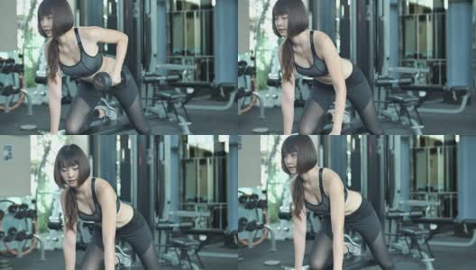 带着哑铃在健身房锻炼的女人高清在线视频素材下载