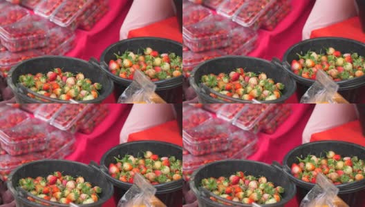 露天食品市场出售的草莓。有机新鲜的草莓高清在线视频素材下载