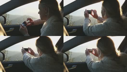 女人在车里放松，在山上用智能手机拍照高清在线视频素材下载