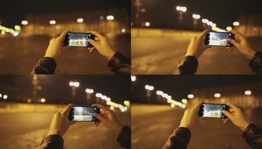 年轻女子在夜间拍照。高清在线视频素材下载
