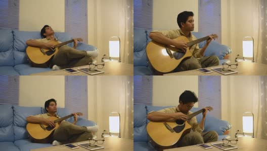 一个年轻人在弹吉他，时间一停，他就放松下来高清在线视频素材下载