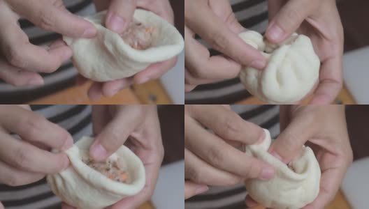 女厨师用手把腌猪排的面团捏成圆面包。包子的制作过程。高清在线视频素材下载
