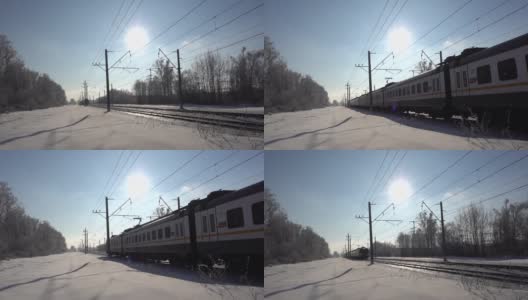 俄罗斯，莫斯科地区，2022年2月5日。电动客运列车移动。冬天的阳光灿烂的日子高清在线视频素材下载