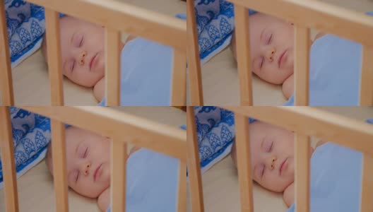小婴儿睡在他的婴儿床里，靠近点高清在线视频素材下载