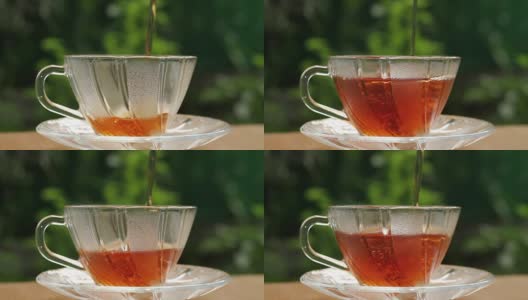 在泰国清晨的阳光下，将热茶倒入绿色的玻璃茶杯中高清在线视频素材下载