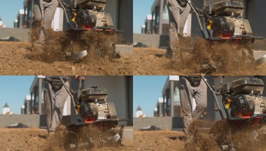 超级SLO MO园丁用耕耘机在草坪上犁地高清在线视频素材下载