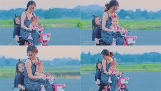 亚洲妈妈和女儿一起骑车高清在线视频素材下载